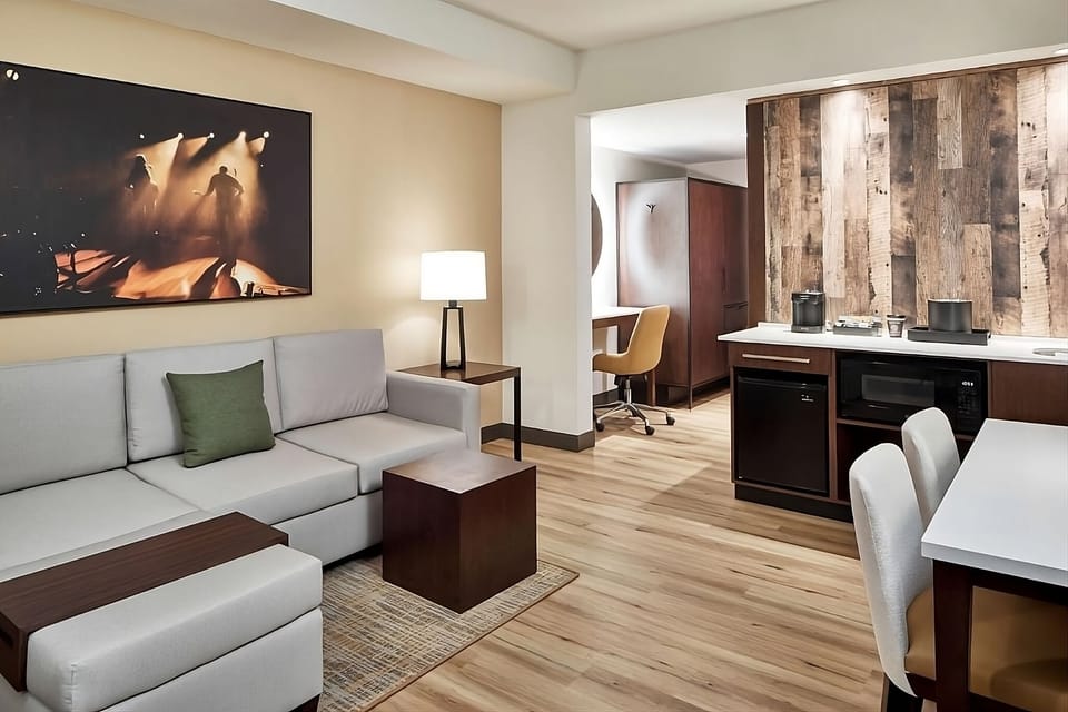 Lounge comfortably with open-concept seating and warm ambient light.