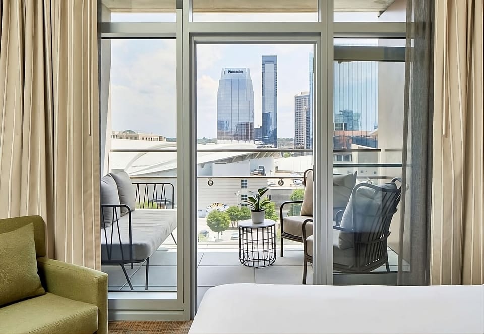 Sip coffee on the balcony while the city sparkles below.