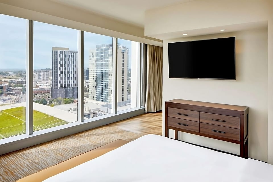 Soak up panoramic cityscapes from a bright corner king room.