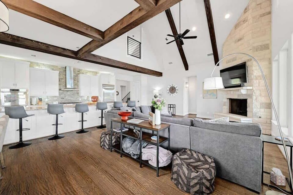 Cook at home and never miss out on the fun. Modern and open kitchen/family room with a view.