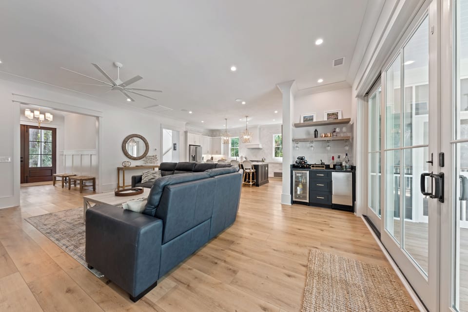 A bar in the great room with beverage center and ice maker