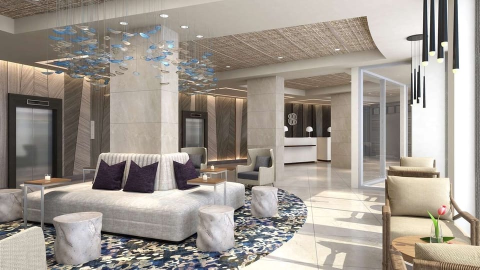 Arrive and unwind in a bright, design-forward lobby lounge.