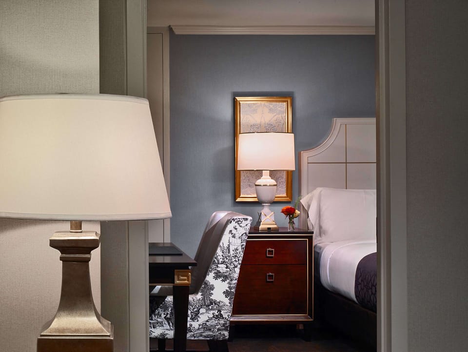 Catch up on emails at a quiet desk beside the bed.