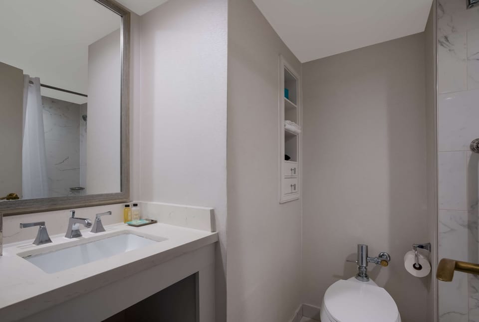 Freshen up easily with streamlined fixtures and tidy storage.