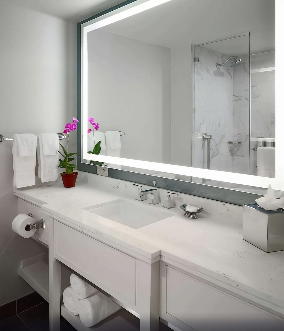 Start your morning with a luminous vanity and fresh towels.
