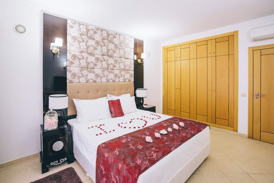 Celebrate special stays with rose petals on crisp white linens.