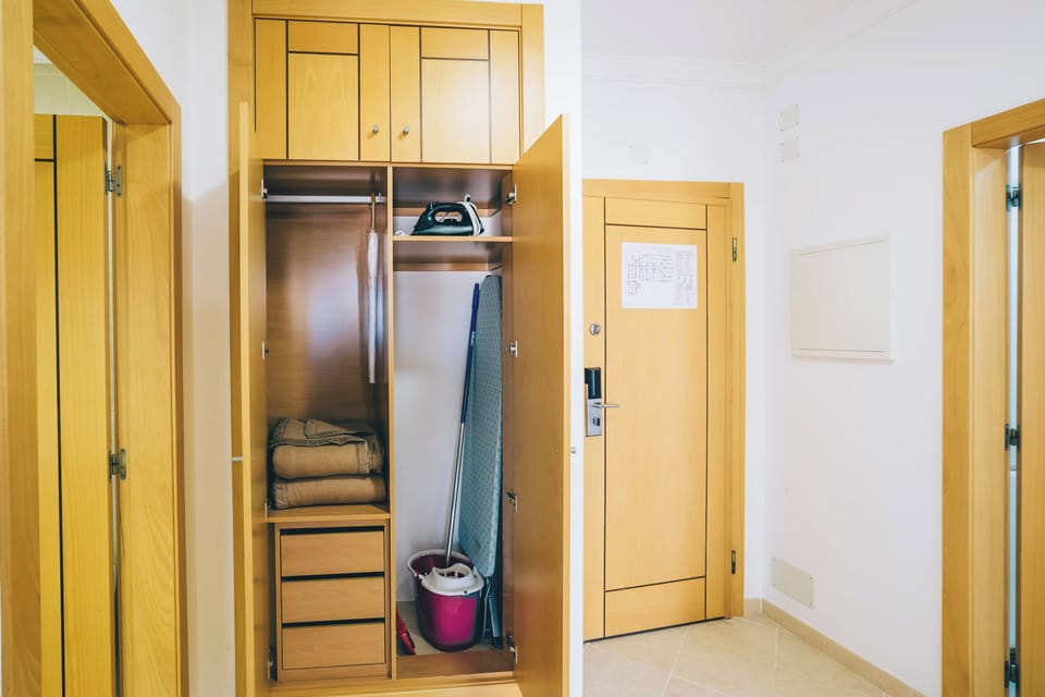Keep extended stays simple with practical in-room storage.