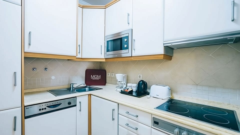 Cook with ease using the full hob, microwave, and sink.