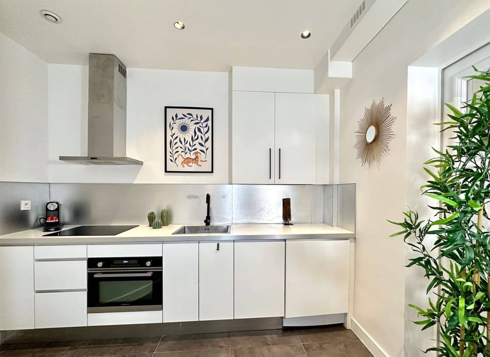 The kitchen is furnished with top-quality equipment