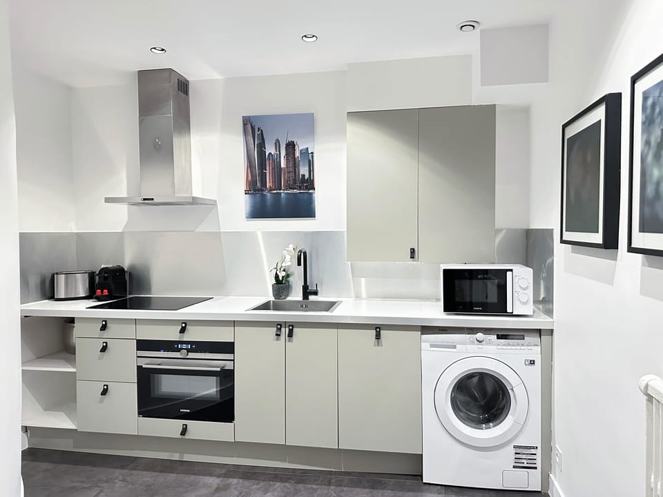 You will find all you need in the kitchen, washer included