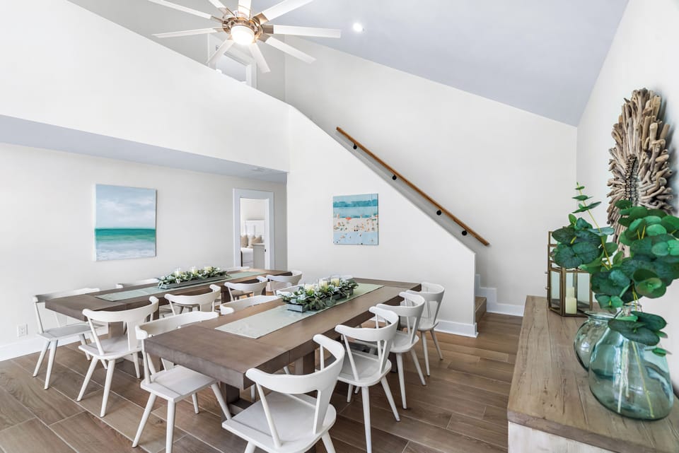 Dining Tables for 16 people Plus the 4 Seats in the Kitchen. Stairs leading up to 2 More Bedrooms!!