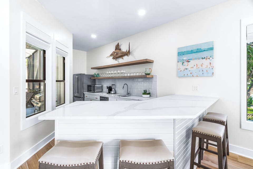 Full Size Living Room Bar with a Second Full Size Refrigerator and Free Standing Ice Maker and Wine Cooler, Microwave and Blender!! With Seating for 4 More!!