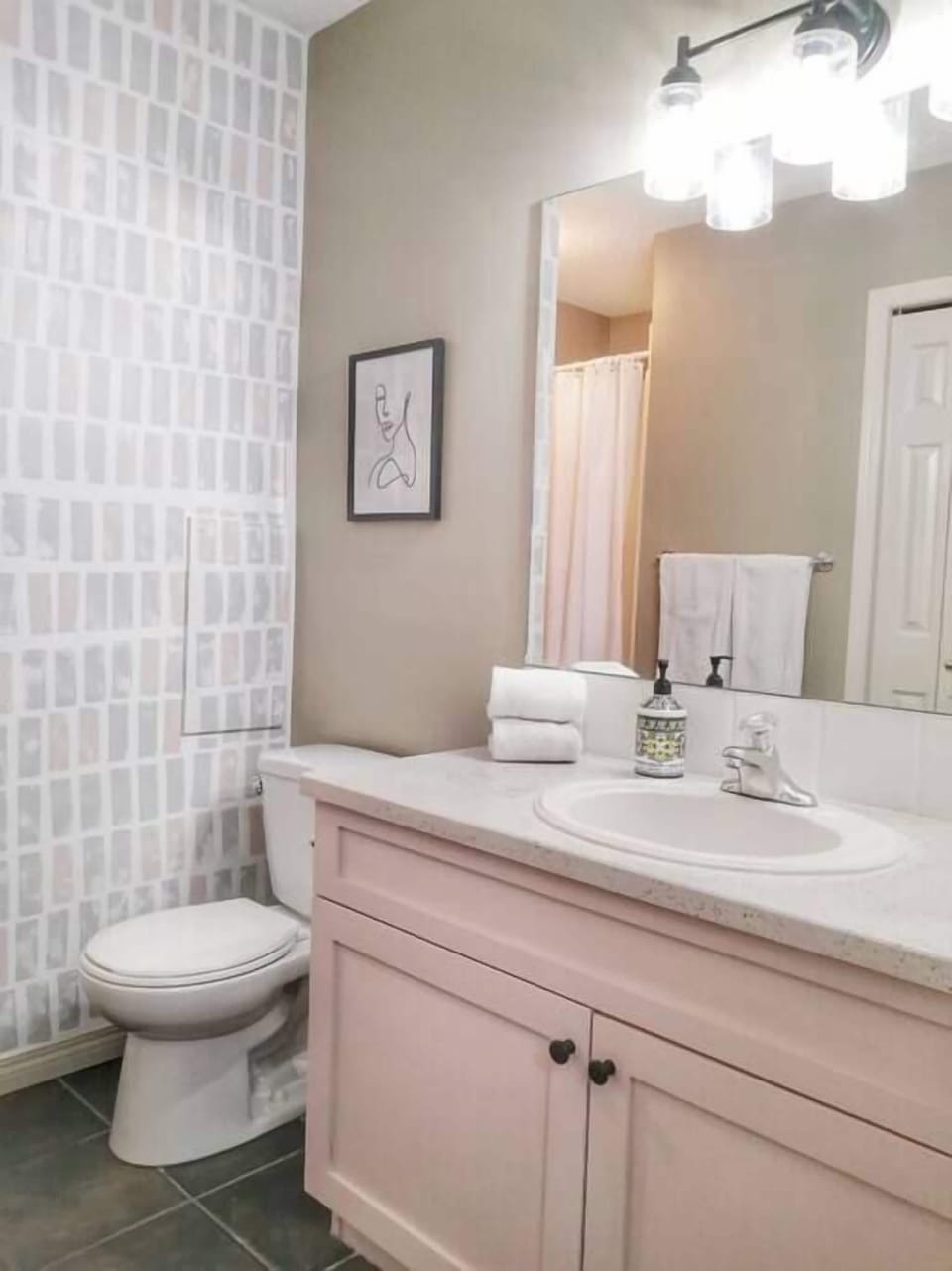 Ground level bathroom with shower and laundry.