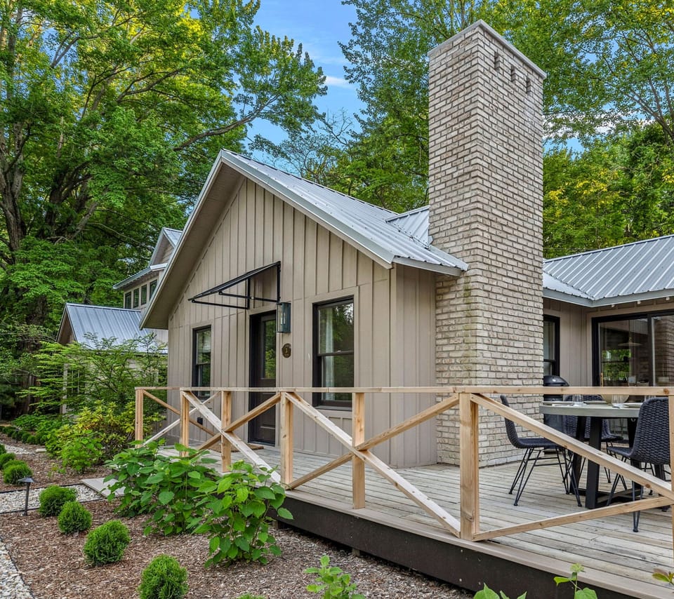 This charming cabin with a cozy deck and inviting patio is the perfect spot to unwind and soak in nature's beauty.