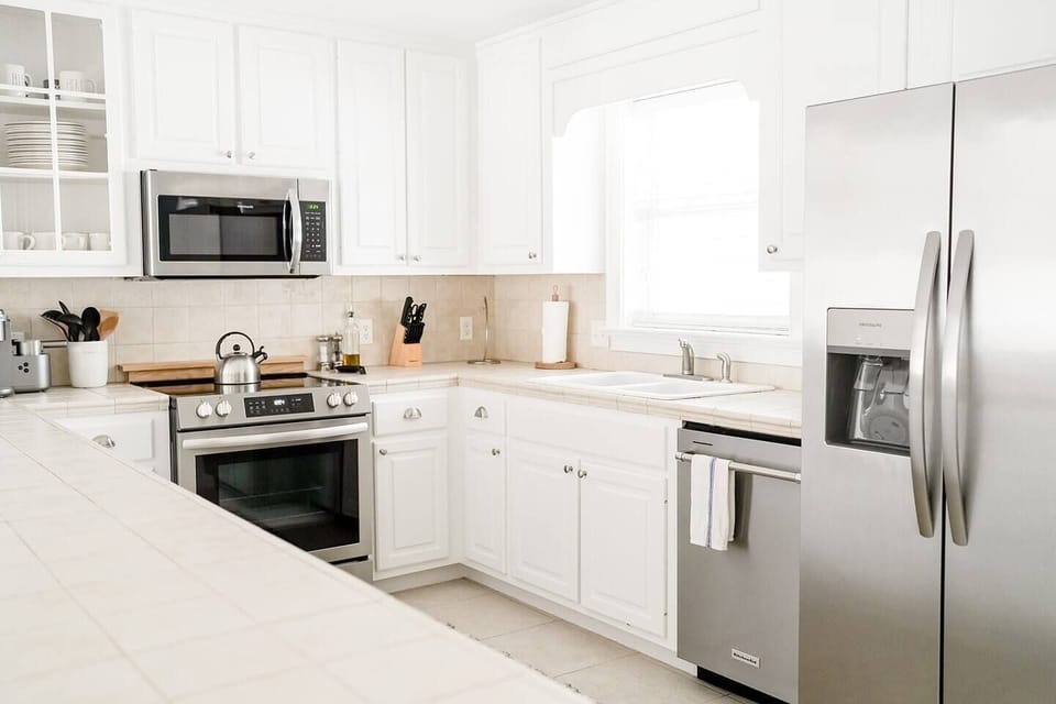 Kitchen with Access to Balcony with Outdoor Dining Area. 