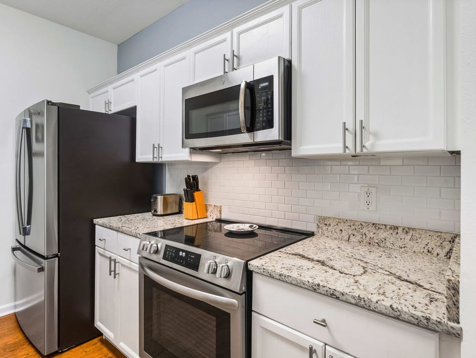 Freshly updated kitchen with stainless appliances and granite counters