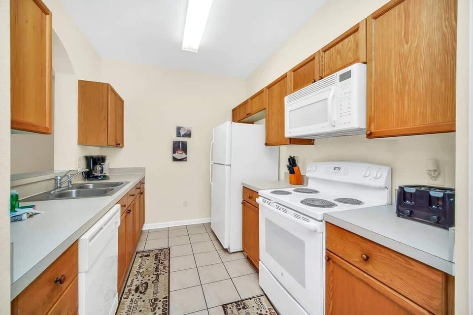 Kitchen is equipped with all the essential.