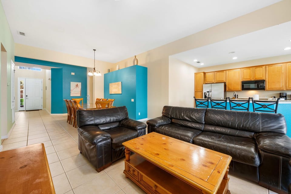 Comfortable living room with updated paint tones and natural light throughout.