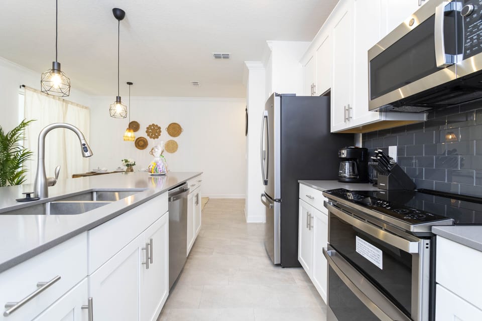 A fully equipped and comfortable kitchen ready for family gatherings where you can feel as cozy as home. Microwave, oven, dishwasher, refrigerator and stove available for you to cook.