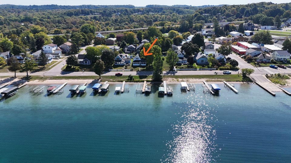 OVERVIEW:  Aerial view from over Crystal Lake showing the location of the cottage via the orange arrow.