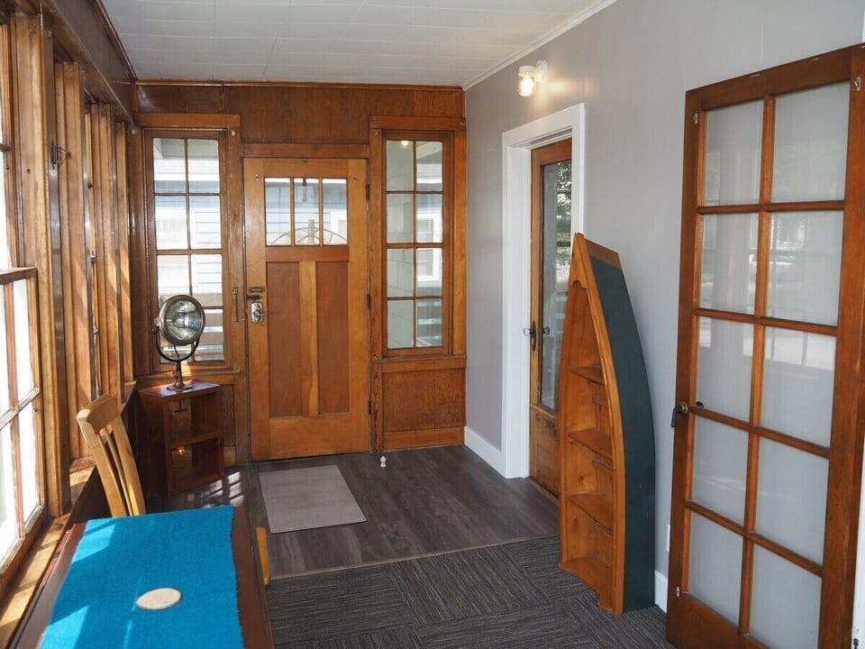 FRONT PORCH:  The home has a lovely enclosed "Three Seasons Porch" (i.e. unheated) that is great for morning coffee, relaxing, and reading!