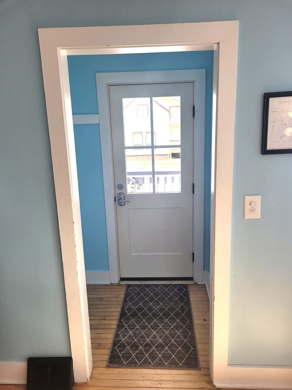 FRONT FOYER:  The home has a convenient front foyer at the main entrance, with hooks for coats and space for shoes.