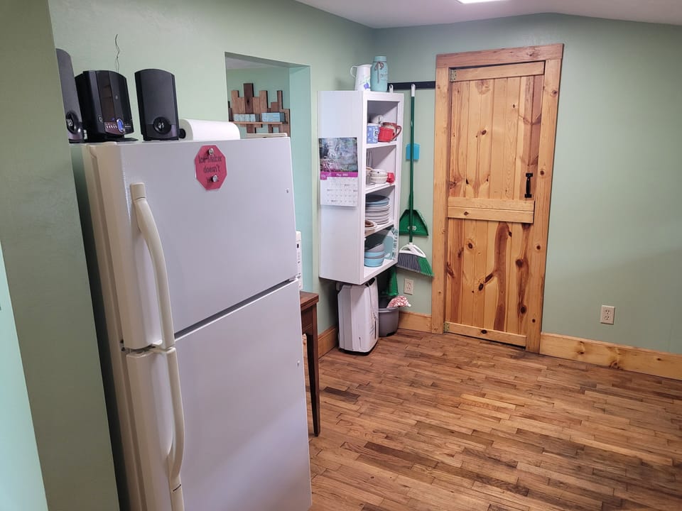 KITCHEN:  The kitchen with the fridge in the back
