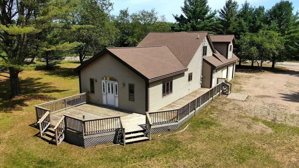 OVERALL:  A good aerial photo highlighting the privacy of the property and the large deck