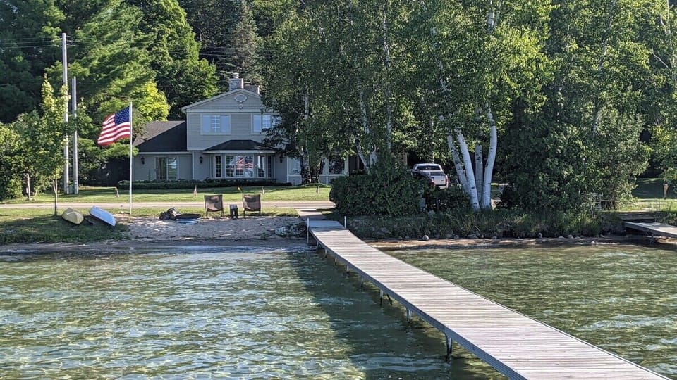 OVERVIEW:  Looking at the home and the gorgeous lakefront from out on the private dock.