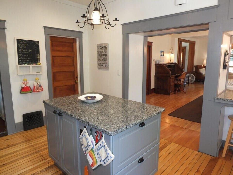 KITCHEN:  Another angle, showing the entrance out to the dining area (on the right) and the door to the first floor bathroom (on the left).