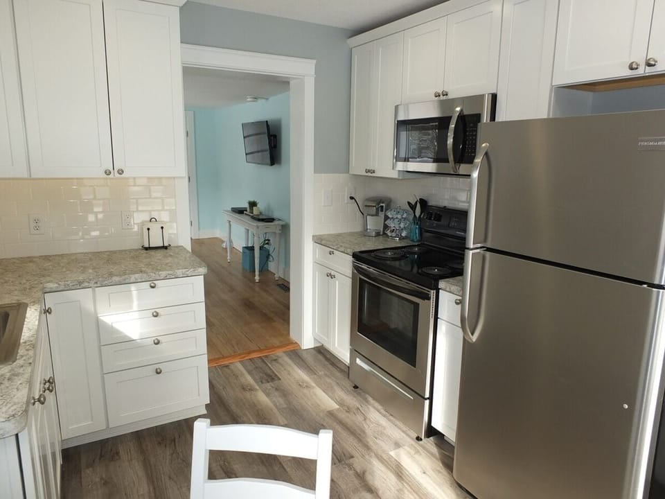 Kitchen:  An overview of the newly remodeled kitchen that features all stainless-steel appliances