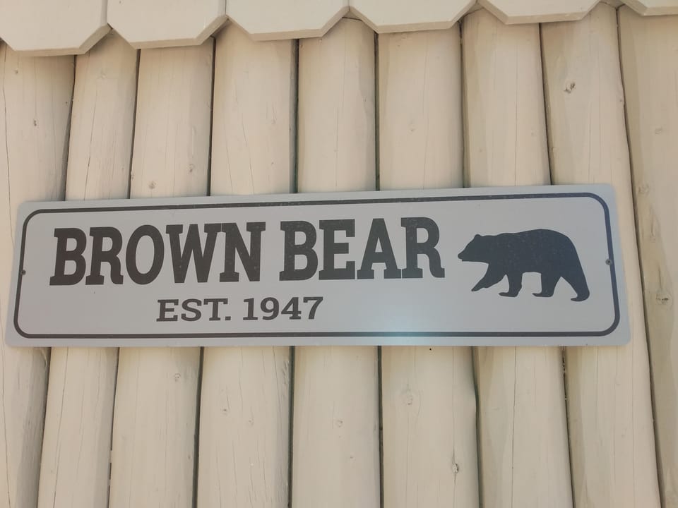 EXTERIOR:  The cute little sign for the cabin