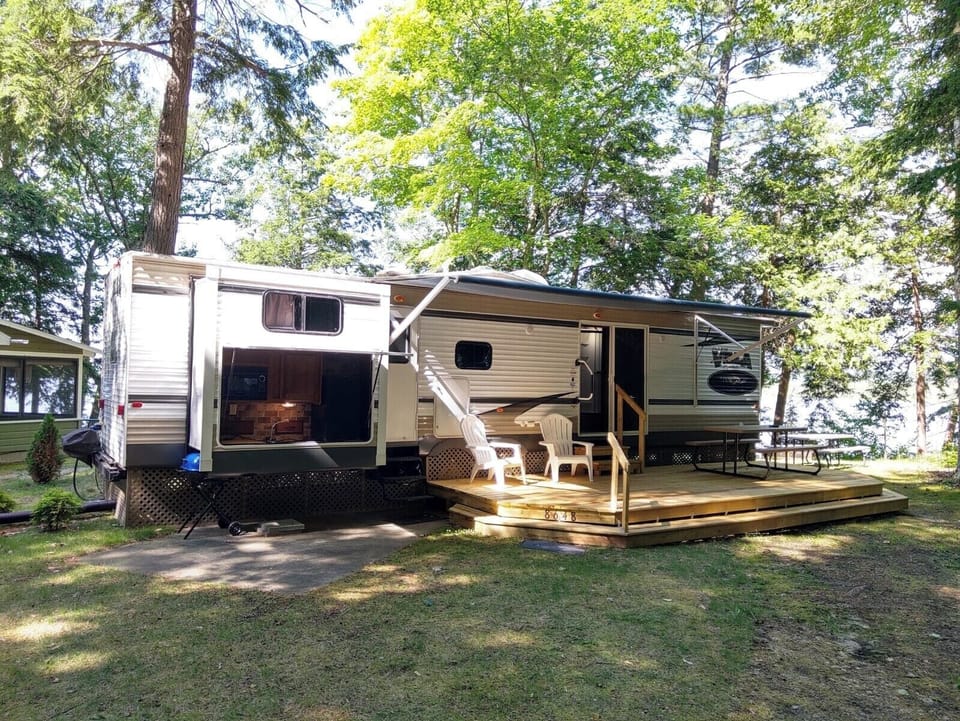 OVERALL:  The front of the park home in summer.
