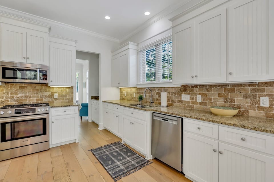 Kitchen with granite counter tops and stainless steel appliances