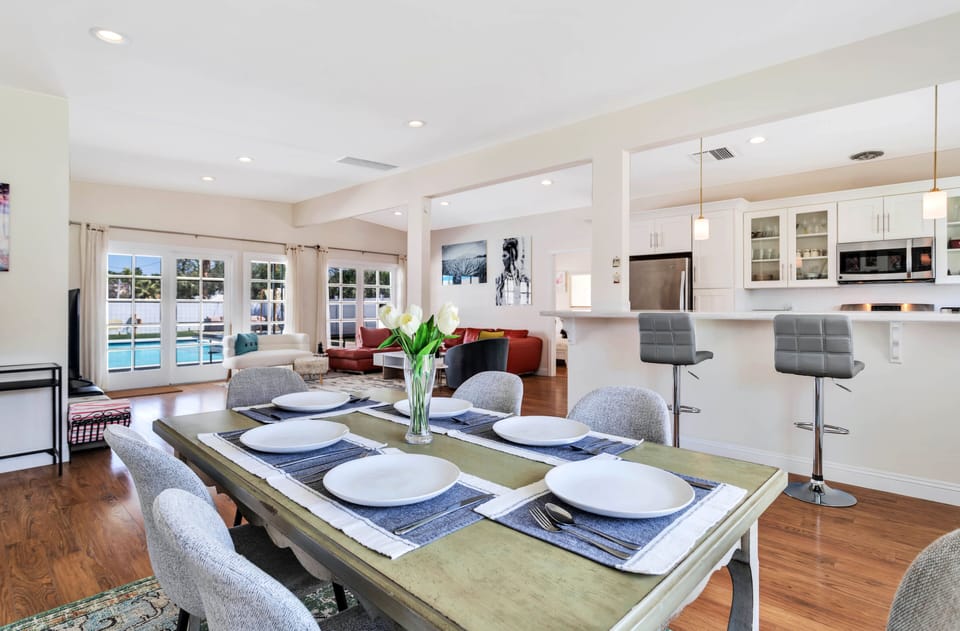 Brightly lit, open concept living/dining/kitchen area