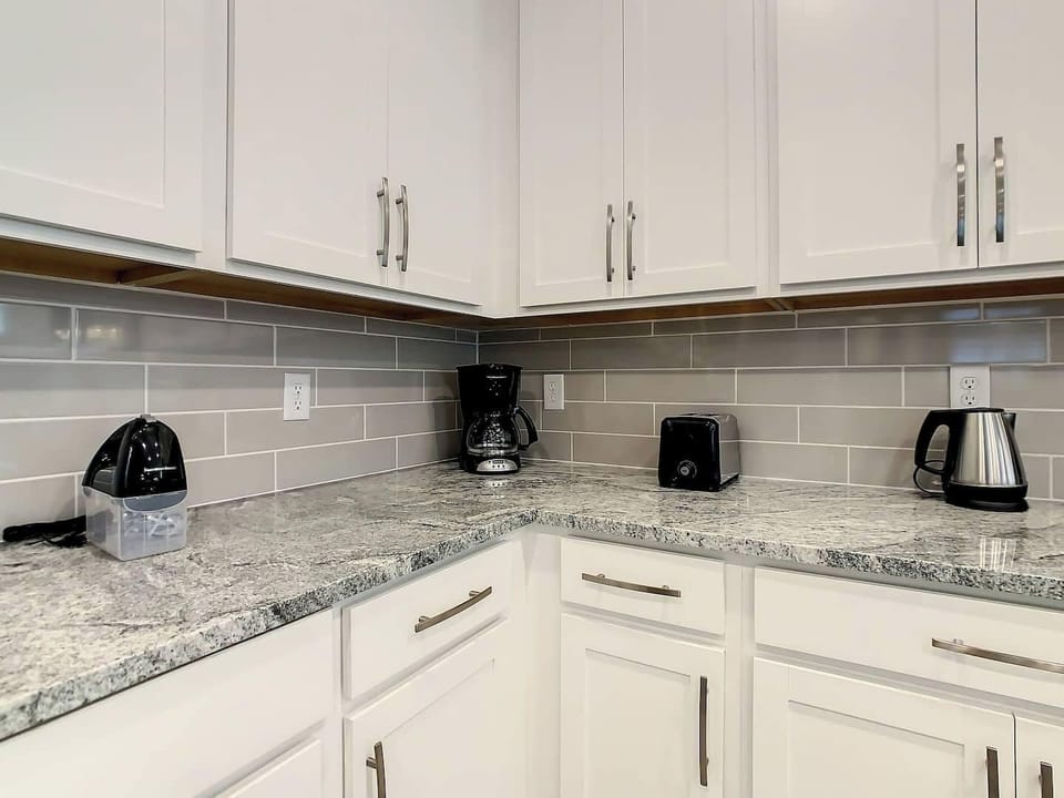 This kitchen is a culinary haven, thoughtfully designed with top-of-the-line appliances and ample amenities. Not pictured is a coffee, Keurig machine. 