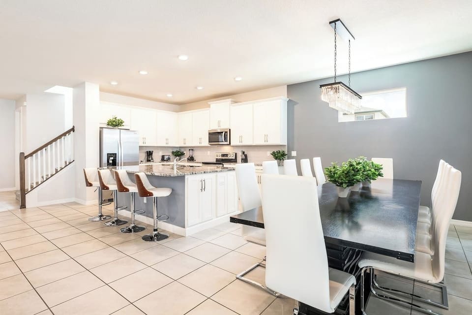 Enjoy making memories around the dinner table with this open-concept kitchen and living room. 