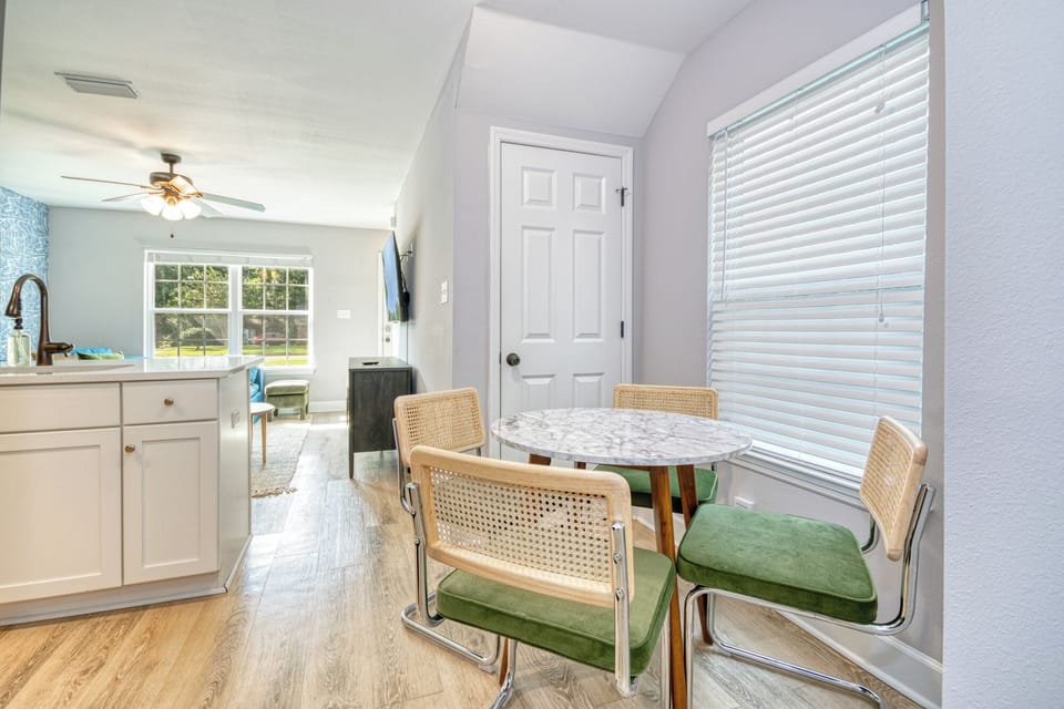 Compact dining room for four people beside kitchen