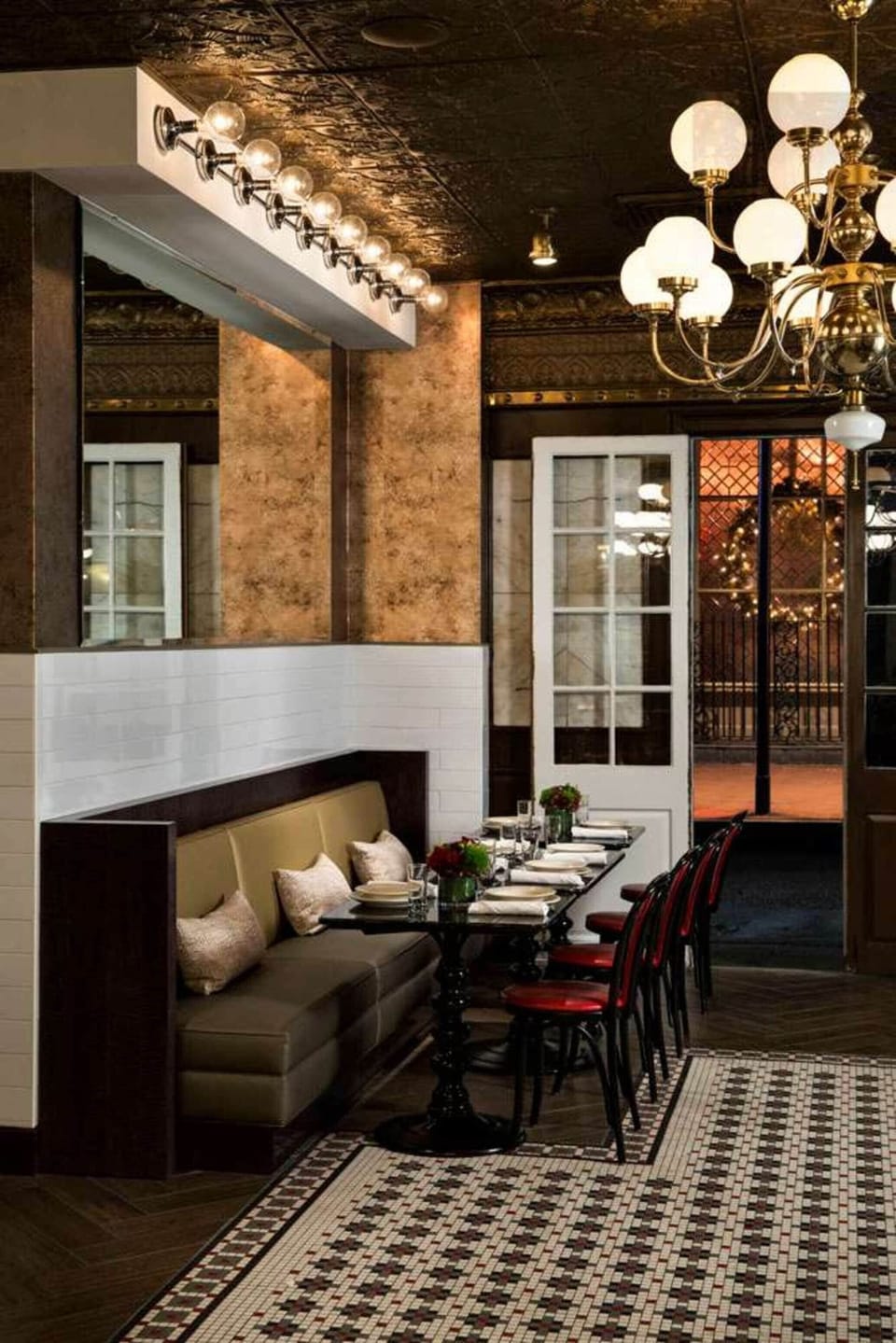 Gather for an intimate meal under warm, elegant lighting.