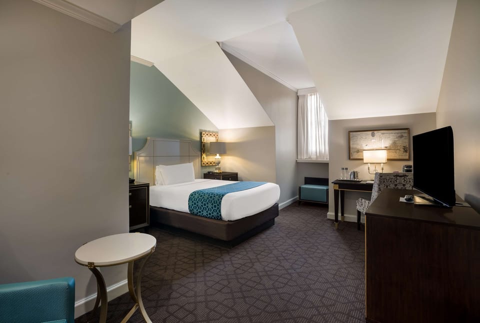 Relax in this bright, spacious bedroom with elegant finishes.