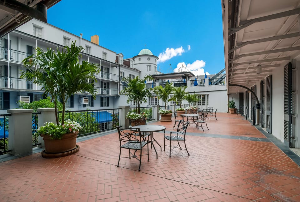 Sip morning coffee on the breezy terrace overlooking the courtyard.