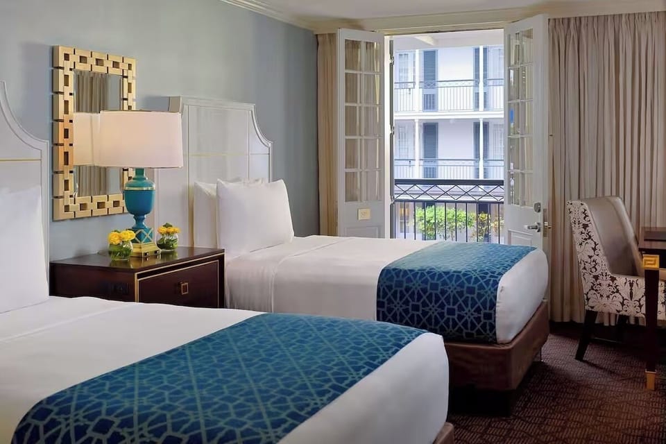Wake up to fresh air through bright balcony doors.