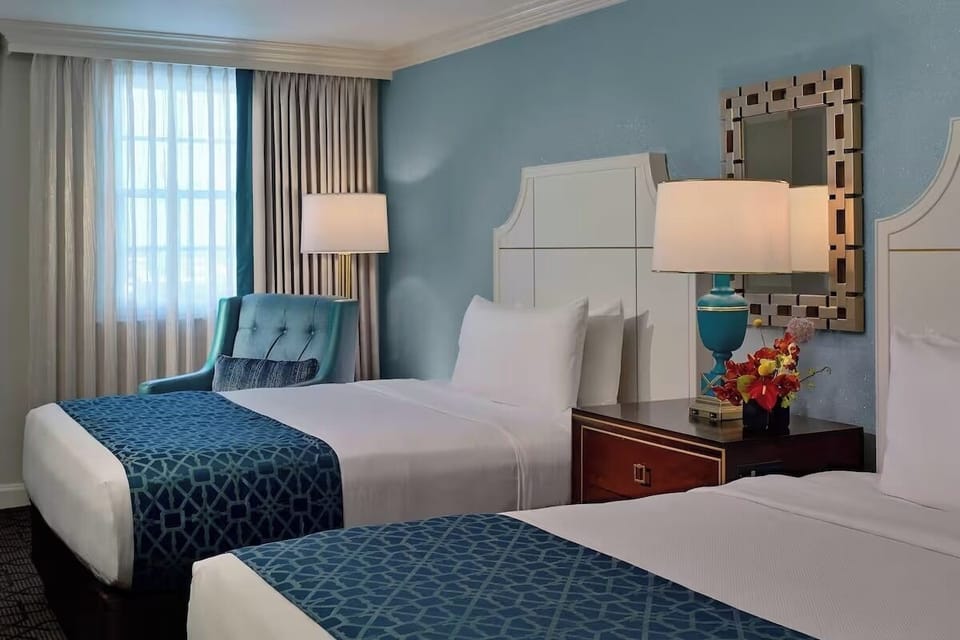 Unwind in cozy seating beside crisp, freshly made beds.