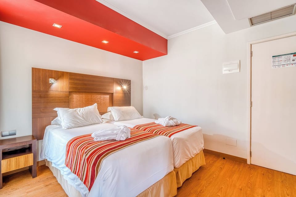 Unwind after adventures in a bright, neatly styled bedroom.
