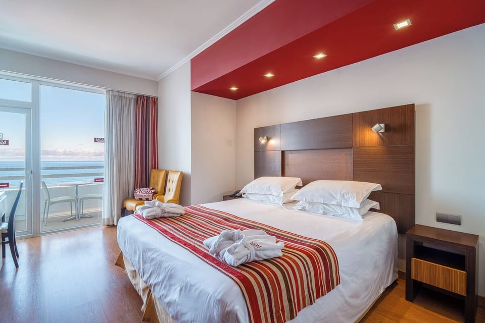 Wake up refreshed with sea-view light spilling onto the bed.