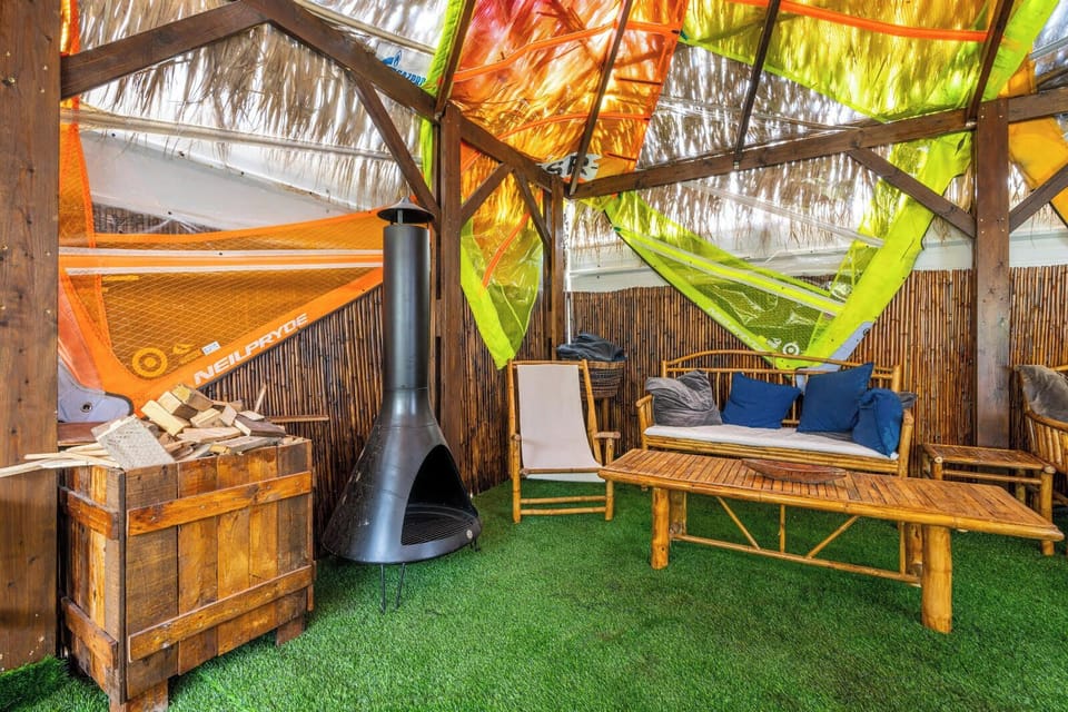 Relax in the garden with cozy seating under the shade of tropical greenery
