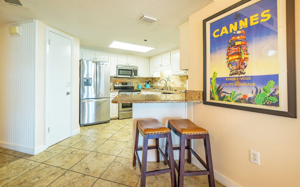 Enjoy casual conversations around the bar seating as you savor the inviting kitchen vibe, perfect for family gatherings