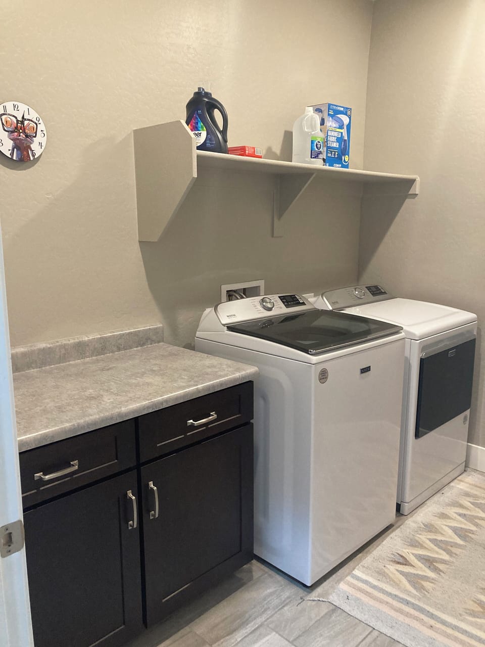 laundry room with essentials and a steamer