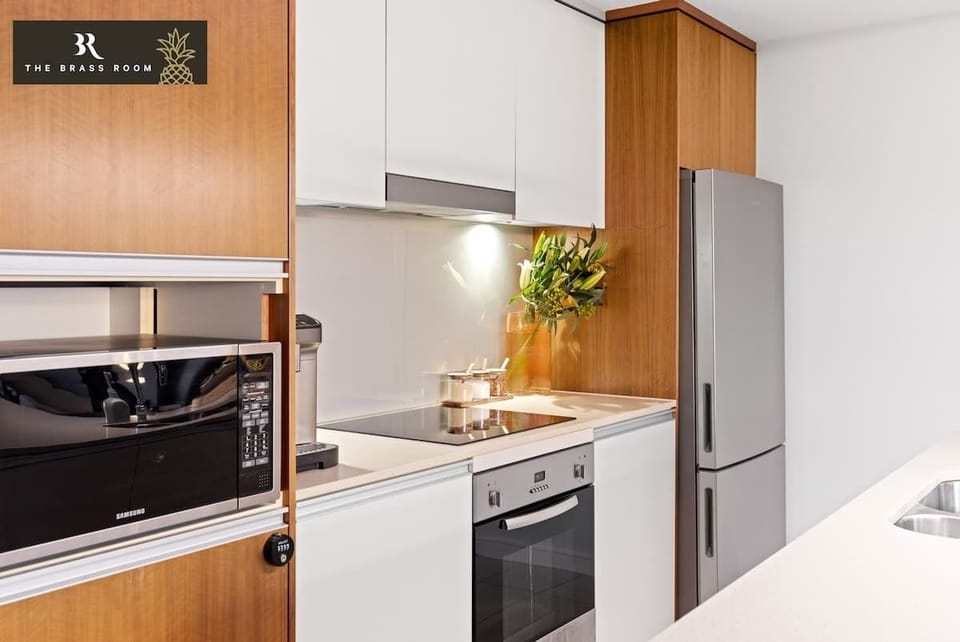Our sleek kitchen features modern appliances and a spacious layout, perfect for cooking and entertaining.