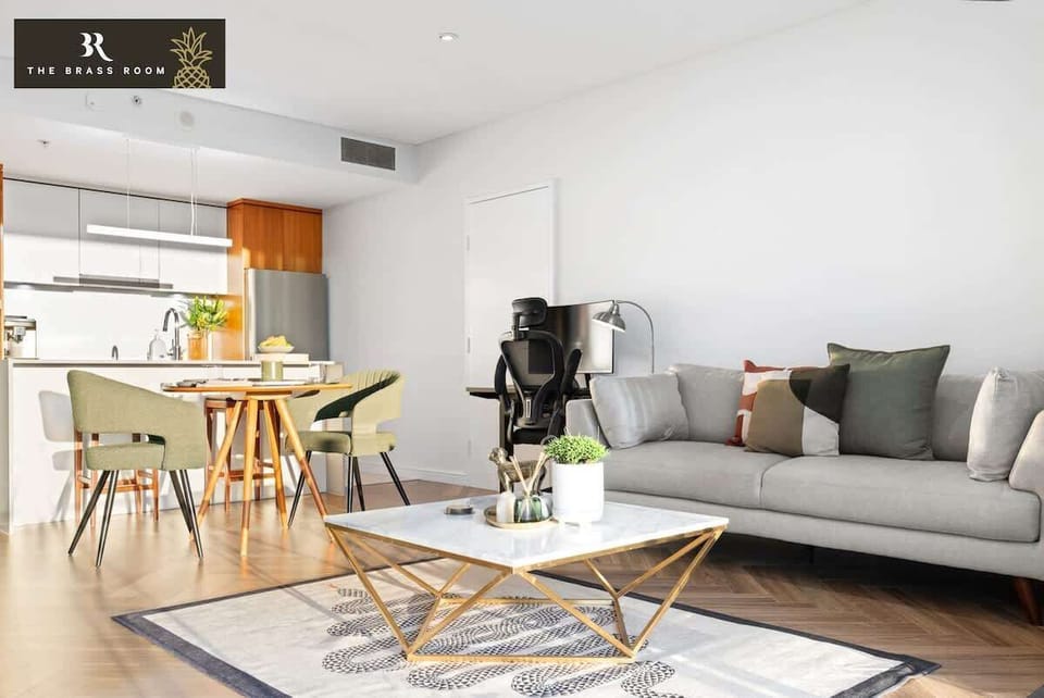 Our living room features beautiful, relaxing chairs and a work-from-home table and chair. It's a comfortable and stylish space for both relaxation and productivity.